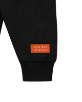 Close-up of the sleeve design on a black Bay or Bust Anthropic signature hoodie from the IPO Collection