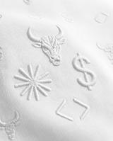 Close-up of the BΛY OR BVST logo on a white Bay or Bust Anthropic signature hoodie