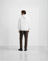 Model wearing a white Bay or Bust Anthropic signature hoodie, back view for the IPO Collection