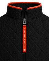 Close-up of the BΛY OR BVST logo on a black Bay or Bust Anthropic signature vest