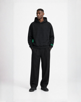 Model wearing a black Bay or Bust OpenAI signature hoodie, front view for the IPO Collection