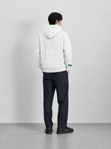 Second lifestyle view of a model wearing a white Bay or Bust OpenAI signature hoodie