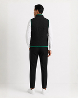 Model wearing a black Bay or Bust OpenAI signature vest, back view for the IPO Collection