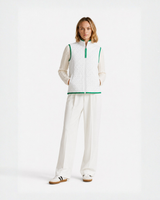 Model wearing a white Bay or Bust OpenAI signature vest, front view for the IPO Collection