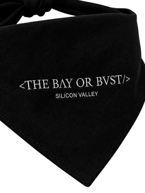 Close-up of the BΛY OR BVST logo on a black Bay or Bust Motto dog bandana
