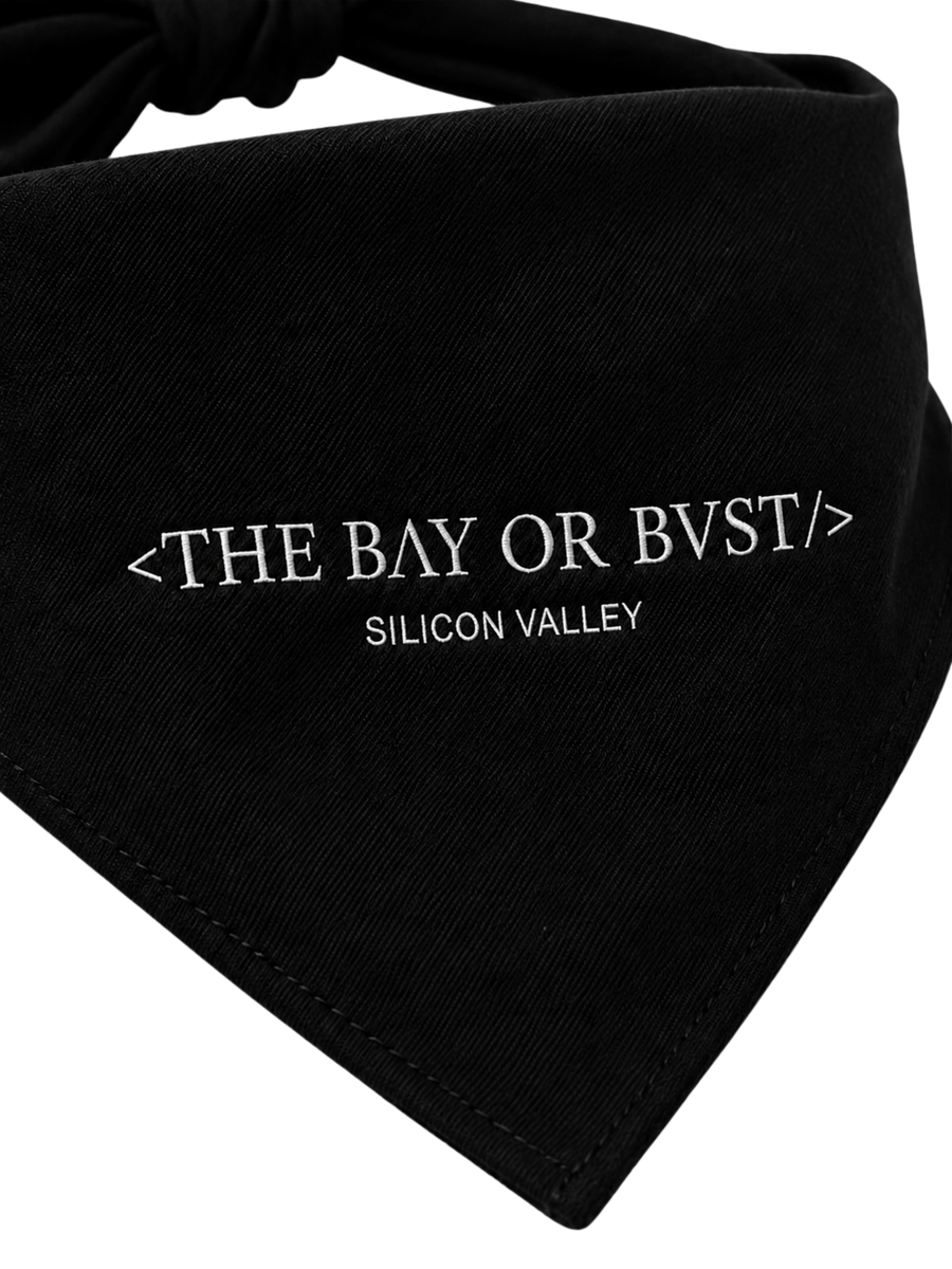 Close-up of the BΛY OR BVST logo on a black Bay or Bust Motto dog bandana